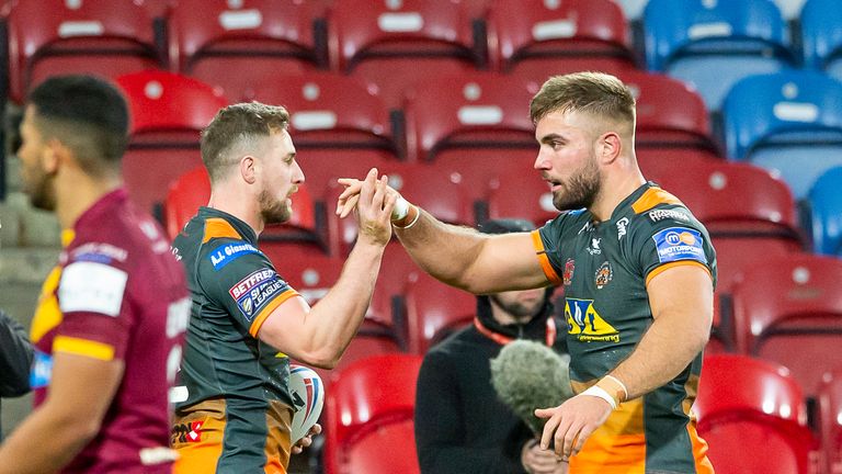 James Clare is congratulated on his try against Huddersfield by Mike McMeeken