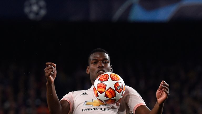 Paul Pogba chests the ball down