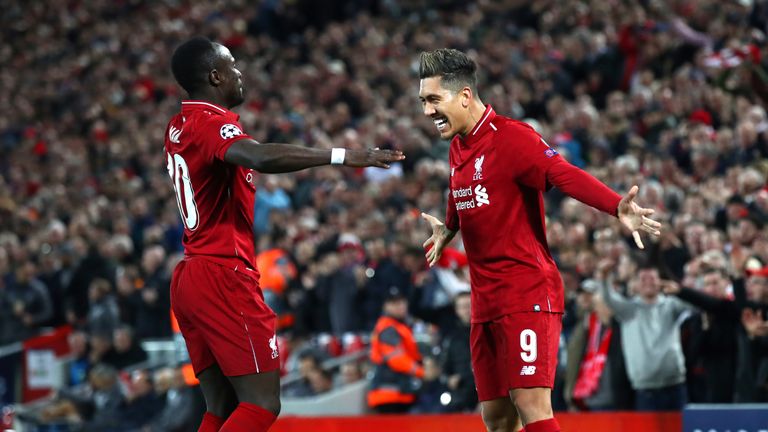 Roberto Firmino celebrates with Sadio Mane after scoring against Porto
