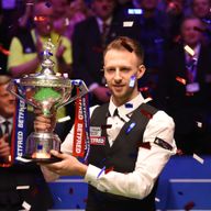 Judd Trump celebrates winning the World Snooker Championship