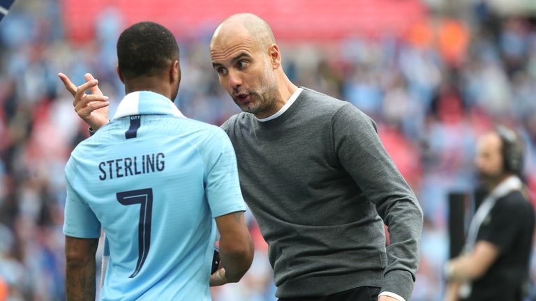 Manchester City's Raheem Sterling and manager Pep Guardiola