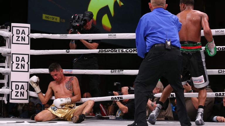 Moran is slumped on the canvas after being knocked out by Haney