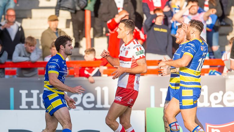 Warrington's Jake Mamo (left) celebrates his early try