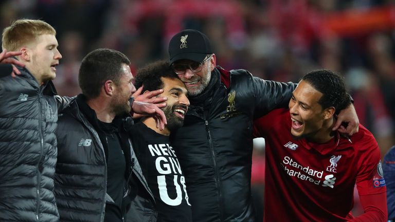 Mo Salah was injured for the game, wearing a t-shirt reading 'Never Give Up'