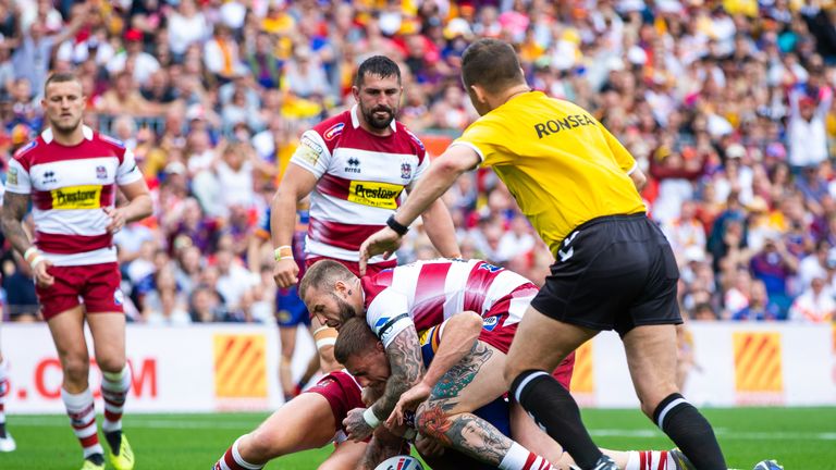Michael McIlorum goes over for Catalans' first try against Wigan
