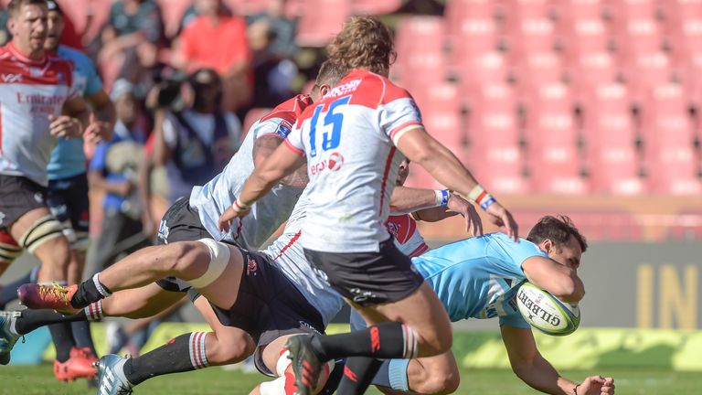 The Waratahs' Nick Phipps goes over for a try against the Lions