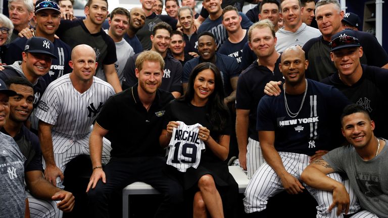 The royal couple pose for a photo with the New York Yankees