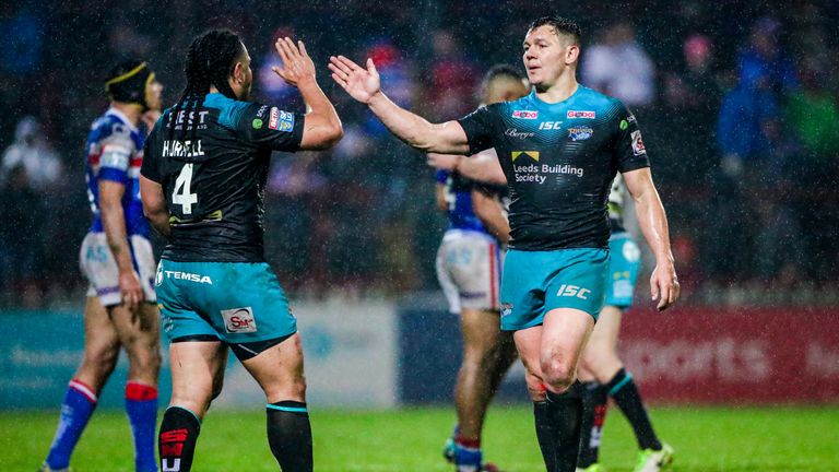 Brett Ferres and Konrad Hurrell celebrate Leeds' win over Wakefield