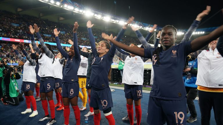 France celebrates in front of a crowd including French President Emmanuel Macron 