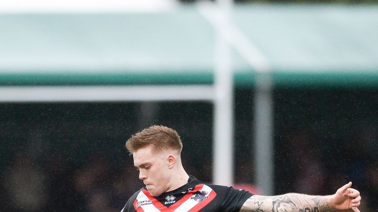 Morgan Smith kicked the winning drop-goal as the Broncos edged out St Helens