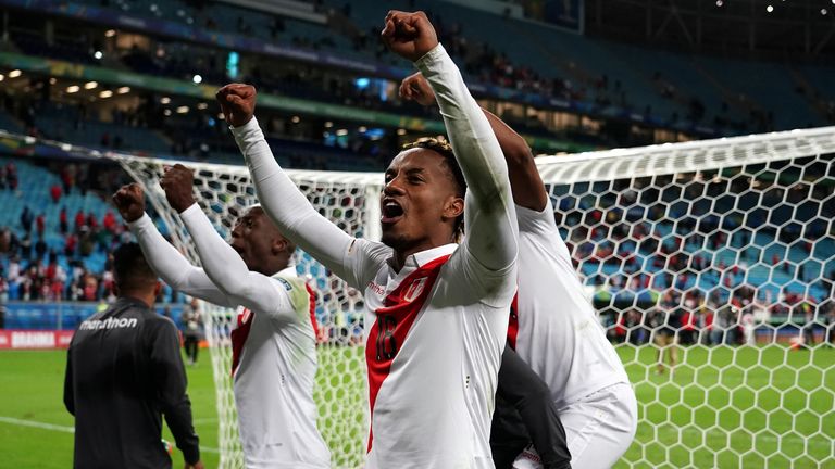 Peru forward Andre Carrillo celebrates with his team-mates after Peru reached their first final in 44 years