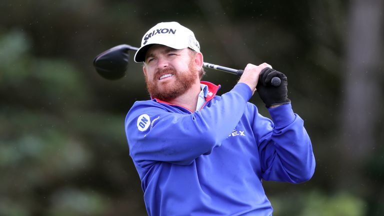 JB Holmes snatched the first-round lead from Shane Lowry