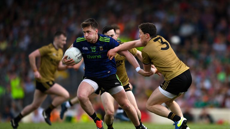 Cillian O'Connor of Mayo is tackled by Tadhg Morley of Kerry