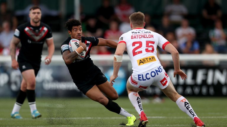 Broncos winger Kieran Dixon runs at the St Helens defence