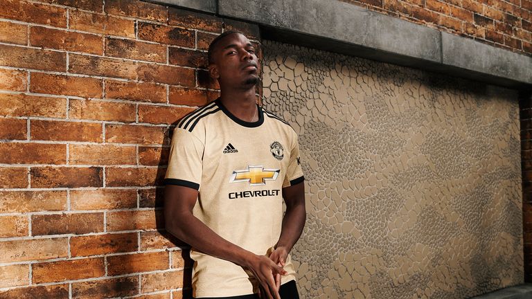 Paul Pogba models Man Utd's away kit