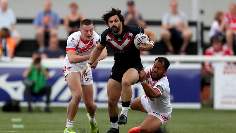 Broncos' Rhys Williams tries to evade two St Helens defenders
