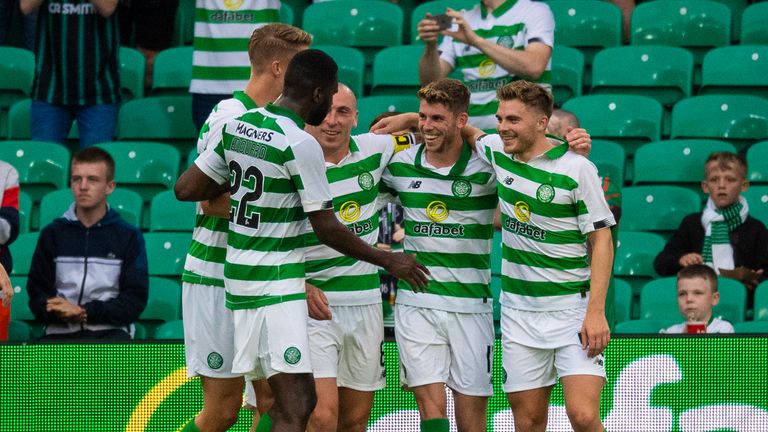 Ryan Christie celebrates with team-mates after he makes it 2-0 from the penalty spot
