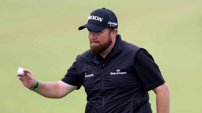 Shane Lowry celebrates a birdie on the ninth during the second round