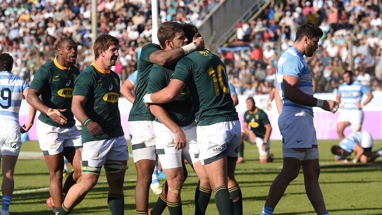 Handre Pollard celebrates a try with his South Africa team-mates