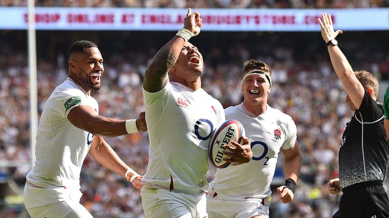 Tuilagi (centre) celebrates his try as England created some daylight late in the first half 