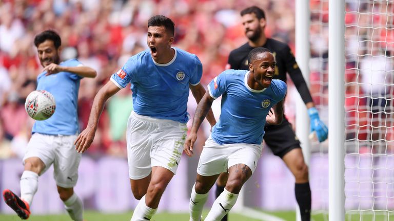 Raheem Sterling celebrates scoring for Manchester City