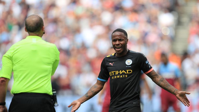 Sterling gestures towards referee Mike Dean after Manchester City's third goal is disallowed by VAR