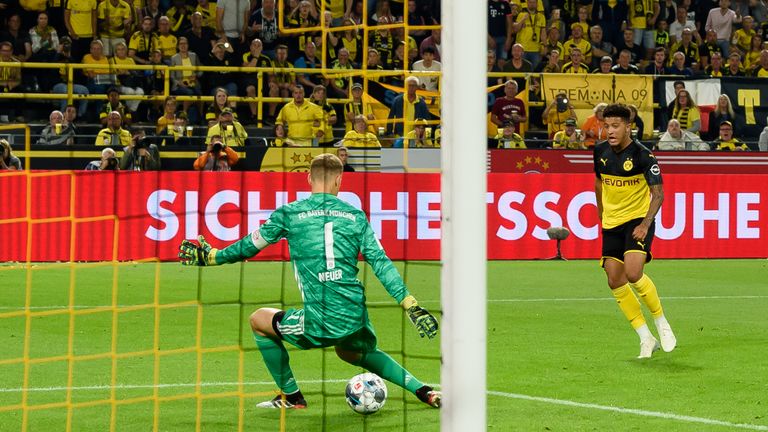 Sancho drills Dortmund's second through the legs of Manuel Neuer