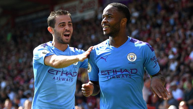 Bernardo Silva celebrates with goalscorer Raheem Sterling as Manchester City net their second goal