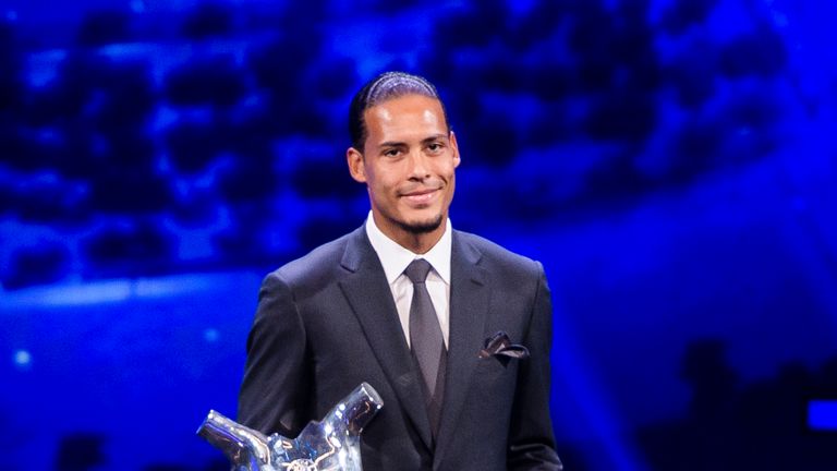 Virgil van Dijk poses with the UEFA Men's Player of the Year award