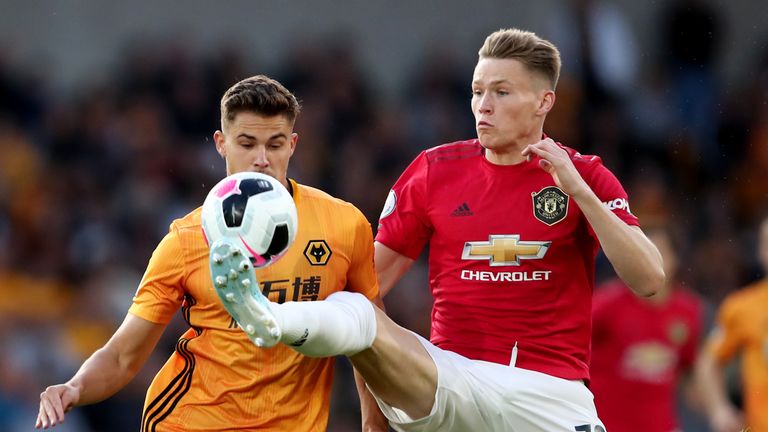 Scott McTominay battles for the ball