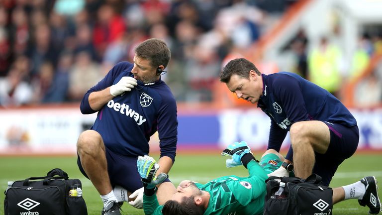 Lukasz Fabianski receives medical treatment at the Vitality Stadium in September