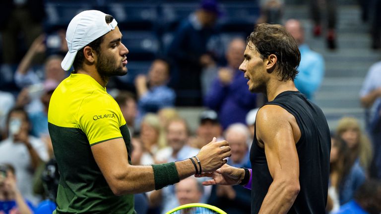 Berrettini (L) congratulates Nadal on his victory