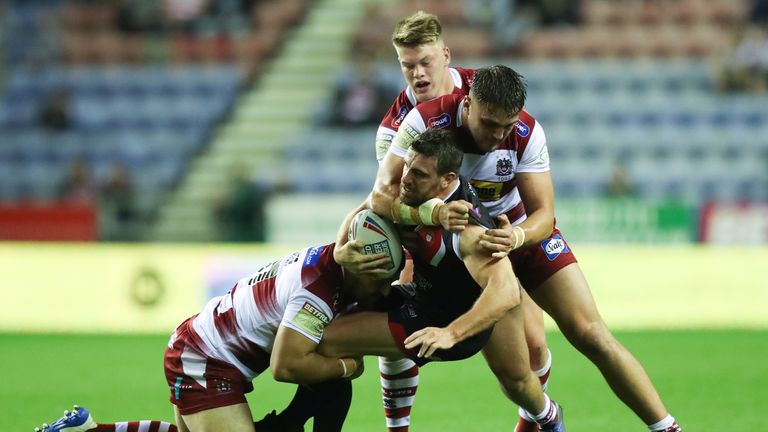 Salford's Tyrone McCarthy can't find a way through the Wigan defence