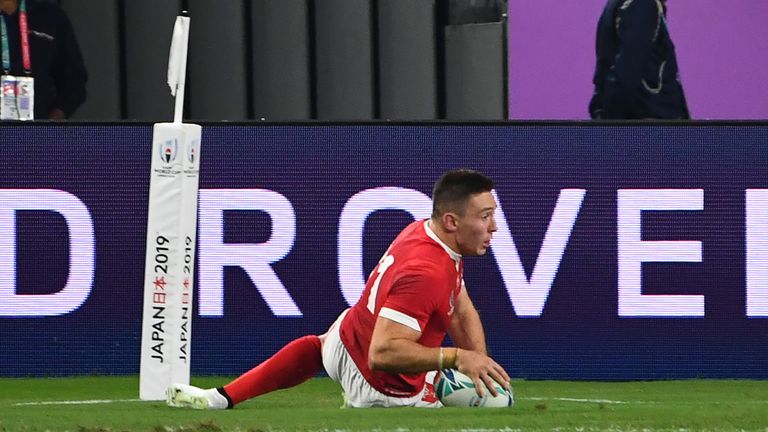 Adams took a high Dan Biggar cross-field kick for his first try