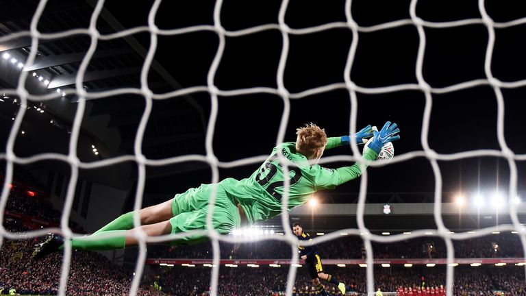 Caoimhin Kelleher saves Dani Ceballos' penalty to send the Reds through