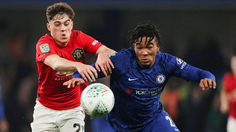 Manchester United's Daniel James and Reece James vie for the ball