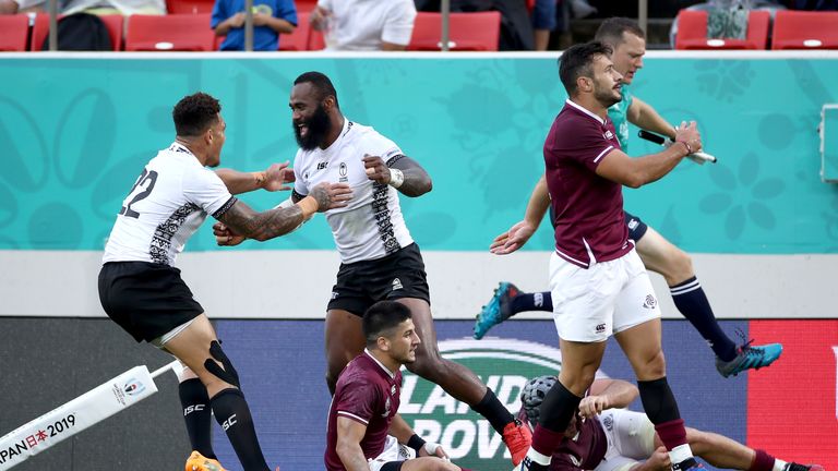 Semi Radradra (right) celebrates with Jale Vatubua after scoring Fiji's seventh try