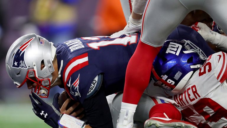 Tom Brady dives into the end zone for a one-yard touchdown run