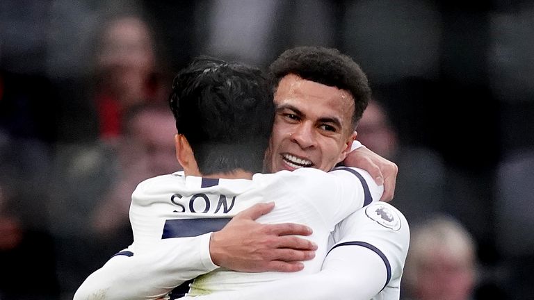 Dele Alli is hugged by Heung-Min Son after putting Tottenham 1-0 up