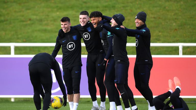 England's Mason Mount, Declan Rice, Tyrone Mings, James Maddison and Jadon Sancho share a joke in training