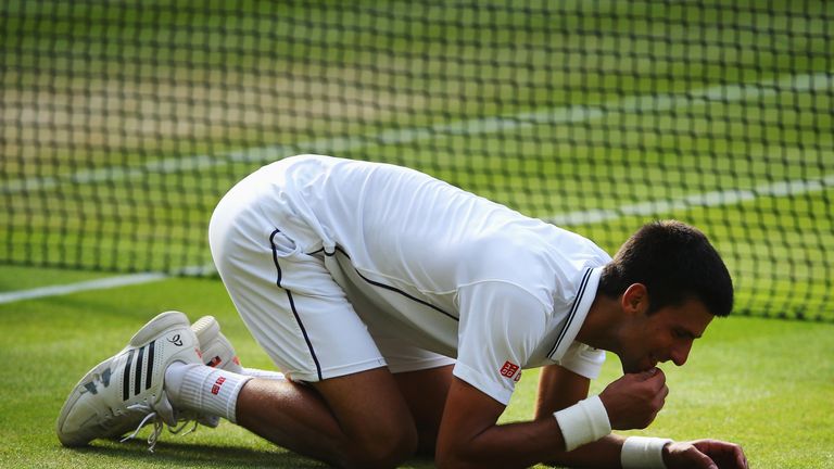 The Serb enjoyed some of the centre court grass after his victory in 2014