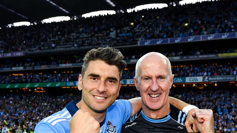 Paul Clarke celebrates the five-in-a-row triumph with Bernard Brogan
