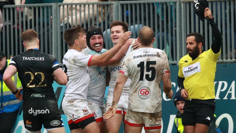 Jacob Stockdale is congratulated after denying Semesa Rokoduguni a match-winning try