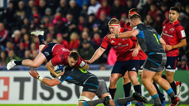 Rory Scannell is tackled by Ospreys captain Dan Lydiate