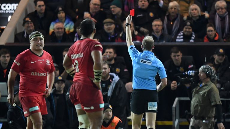 Harry Williams receives a red card on the bench after a brawl