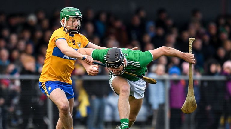 Conor Boylan of Limerick in action against Colin Guilfoyle of Clare