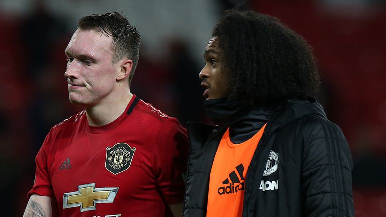 Phil Jones and Tahith Chong trudge off the Old Trafford pitch after the defeat