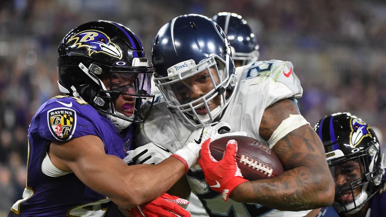 Baltimore Ravens' Marshal Yanda spits at Bengals' Vontaze Burfict