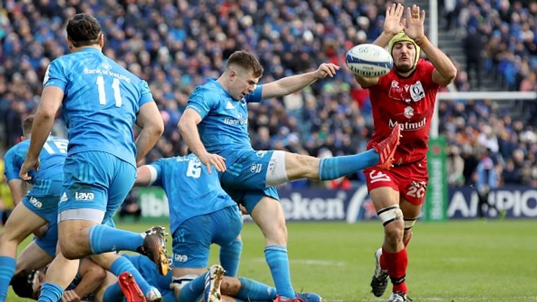 Leinster scrum-half Luke McGrath kicks the ball away during their win against Lyon