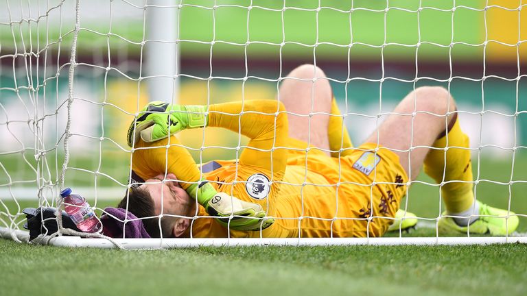 Tom Heaton lies on the turf after picking up an injury in the second half